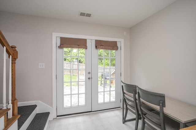 1543 James Gafford Dr, La Vergne, TN 37086 - doorway featuring french doors, stairway, and light wood-style flooring