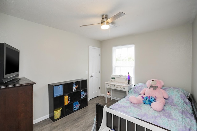 1543 James Gafford Dr, La Vergne, TN 37086 - bedroom featuring wood finished floors, baseboards, and a ceiling fan
