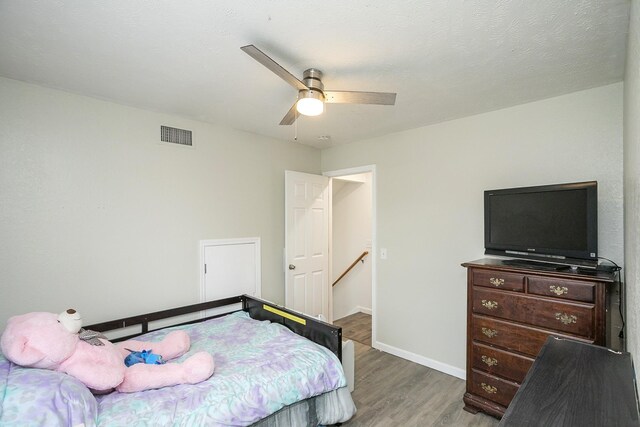 1543 James Gafford Dr, La Vergne, TN 37086 - bedroom featuring light wood-style flooring, baseboards, and a ceiling fan
