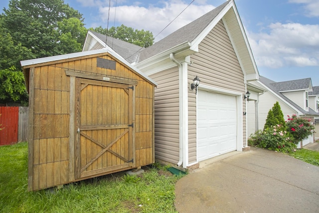 1543 James Gafford Dr, La Vergne, TN 37086 - view of shed featuring fence and concrete driveway