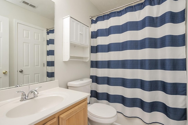1543 James Gafford Dr, La Vergne, TN 37086 - bathroom featuring toilet, vanity, and a shower with shower curtain