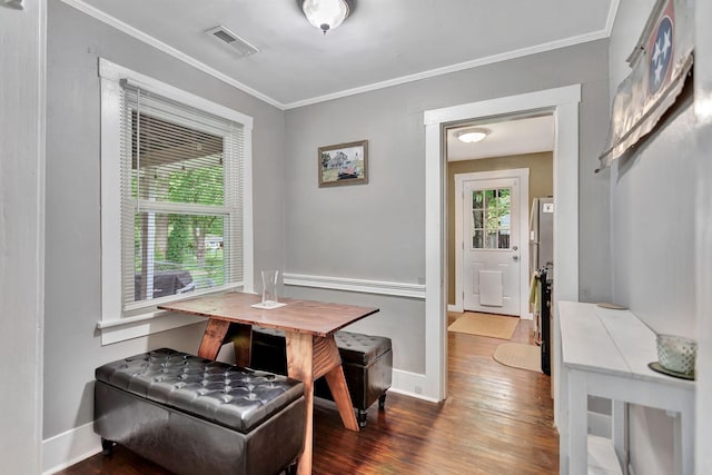 304 5th Ave, Columbia, TN 38401 - dining space with wood finished floors, baseboards, and ornamental molding
