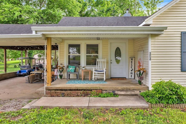 304 5th Ave, Columbia, TN 38401 - doorway to property featuring roof with shingles and covered porch