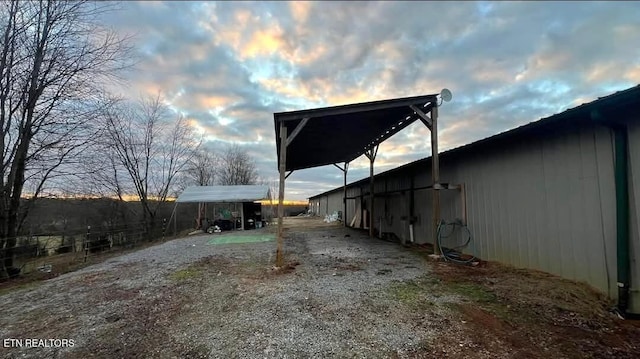 view of side of property featuring a carport