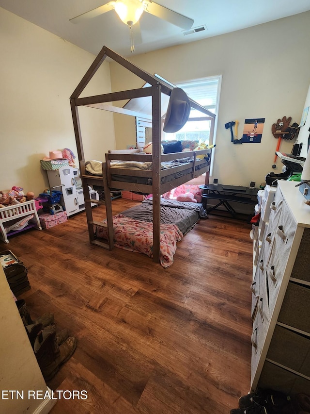 bedroom with wood finished floors and ceiling fan