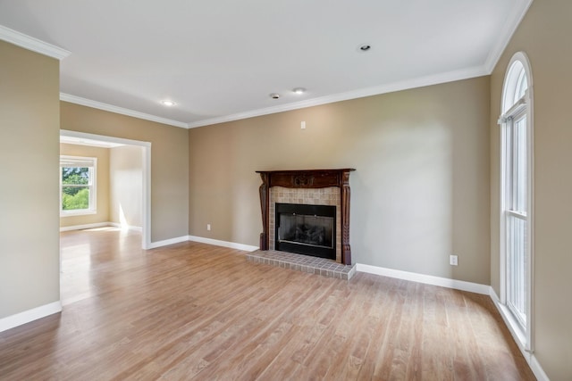 122 Windcrest Dr, Hohenwald, TN 38462 - unfurnished living room featuring light wood-style floors, a fireplace, crown molding, baseboards, and recessed lighting