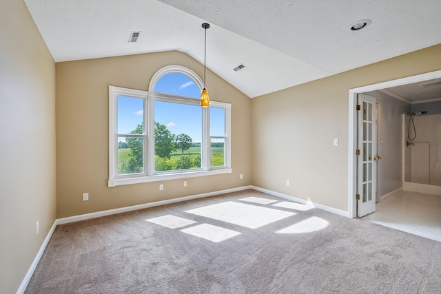 122 Windcrest Dr, Hohenwald, TN 38462 - carpeted spare room with lofted ceiling, baseboards, french doors, and a textured ceiling