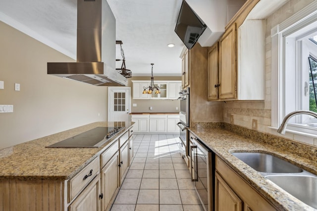 122 Windcrest Dr, Hohenwald, TN 38462 - kitchen featuring island exhaust hood, a sink, stainless steel appliances, light tile patterned floors, and a chandelier