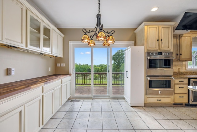 122 Windcrest Dr, Hohenwald, TN 38462 - kitchen featuring double oven, light tile patterned flooring, light brown cabinetry, glass insert cabinets, and backsplash