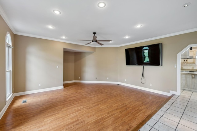 122 Windcrest Dr, Hohenwald, TN 38462 - unfurnished living room with ceiling fan, ornamental molding, recessed lighting, light wood-style flooring, and baseboards