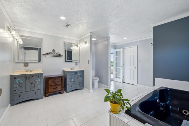 122 Windcrest Dr, Hohenwald, TN 38462 - bathroom featuring crown molding, toilet, tile patterned floors, a tub with jets, and a textured ceiling