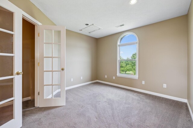 122 Windcrest Dr, Hohenwald, TN 38462 - carpeted empty room featuring french doors, baseboards, and recessed lighting