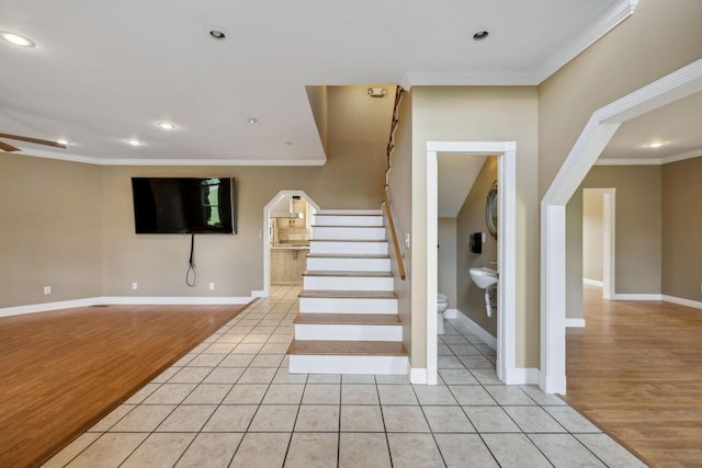 122 Windcrest Dr, Hohenwald, TN 38462 - stairs with crown molding, recessed lighting, baseboards, wood finished floors, and ceiling fan