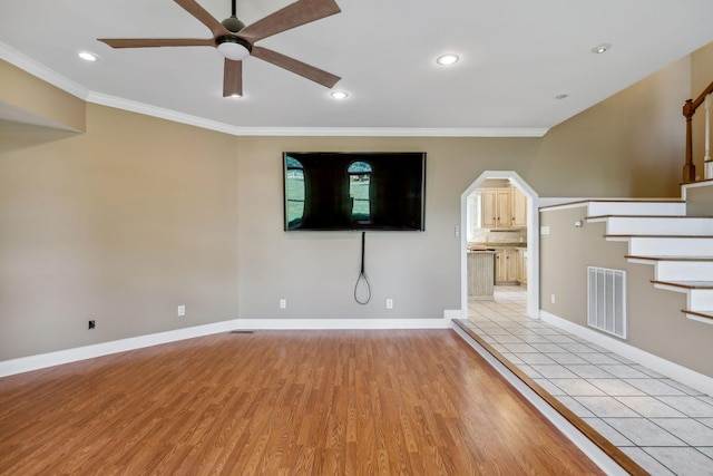 122 Windcrest Dr, Hohenwald, TN 38462 - unfurnished living room featuring a ceiling fan, stairway, light wood-type flooring, ornamental molding, and baseboards