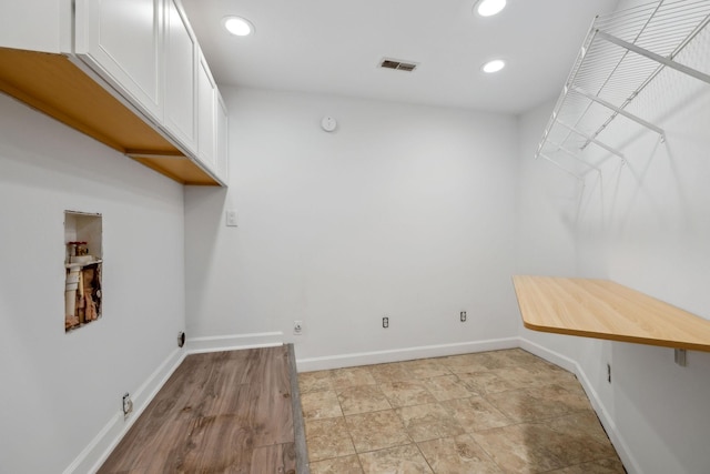 122 Windcrest Dr, Hohenwald, TN 38462 - clothes washing area with cabinet space, hookup for an electric dryer, recessed lighting, baseboards, and hookup for a washing machine