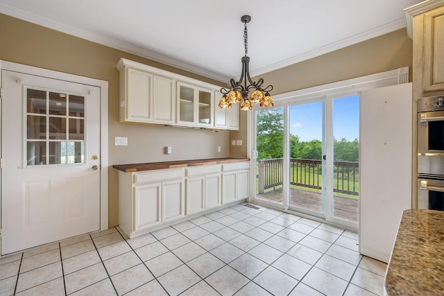 122 Windcrest Dr, Hohenwald, TN 38462 - unfurnished dining area featuring ornamental molding, light tile patterned flooring, and a chandelier