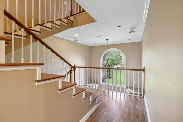 122 Windcrest Dr, Hohenwald, TN 38462 - staircase featuring wood finished floors, ornamental molding, baseboards, and recessed lighting