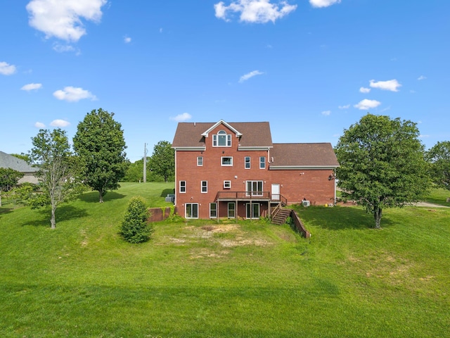 122 Windcrest Dr, Hohenwald, TN 38462 - rear view of house with a wooden deck, a yard, brick siding, and stairs