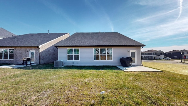 363 Turfway Park, Gallatin, TN 37066 - rear view of house with central air condition unit, a lawn, a patio, and roof with shingles