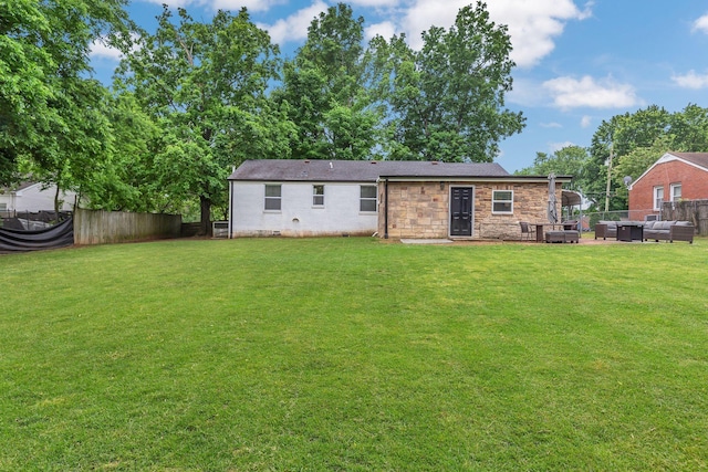 back of house with crawl space, outdoor lounge area, and a patio area