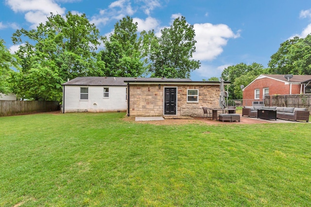 rear view of house with an outdoor hangout area, a patio area, and stone siding
