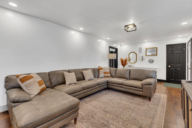 living area featuring wood finished floors and recessed lighting