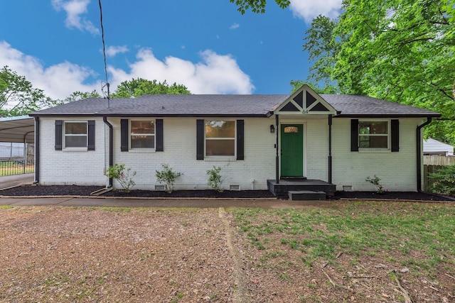 ranch-style home featuring brick siding, crawl space, and fence