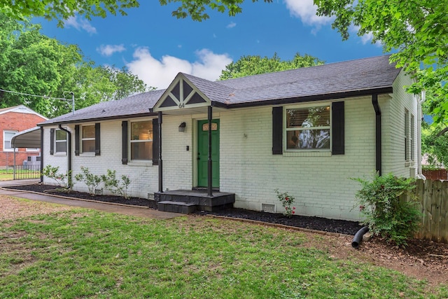 single story home featuring brick siding, crawl space, and a shingled roof