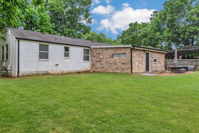 back of property featuring a patio, a gazebo, an outdoor living space, brick siding, and crawl space
