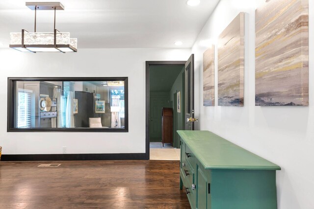 hall with recessed lighting, wood finished floors, and baseboards