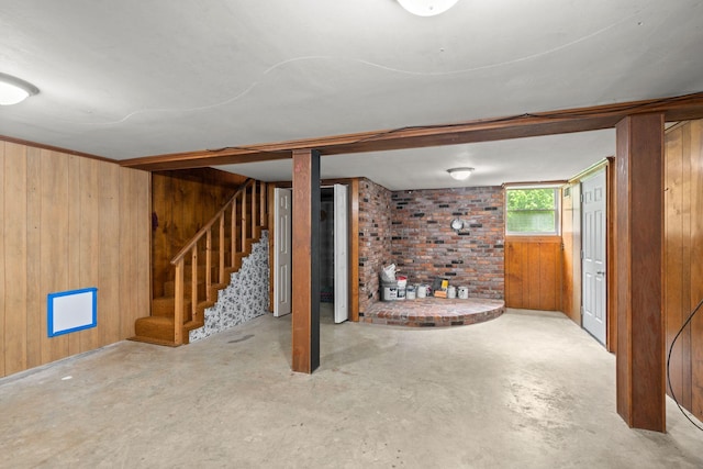 below grade area with wooden walls and stairs