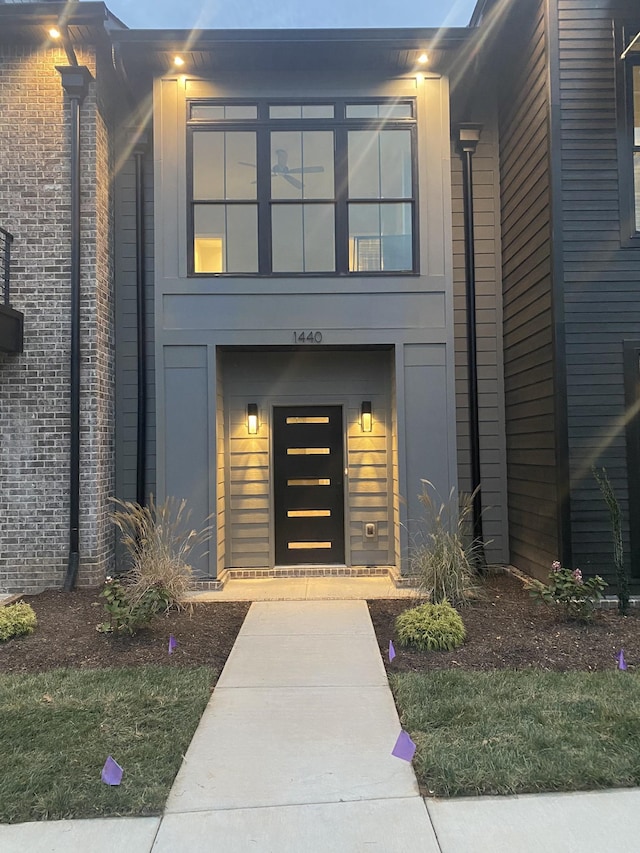 property entrance with brick siding