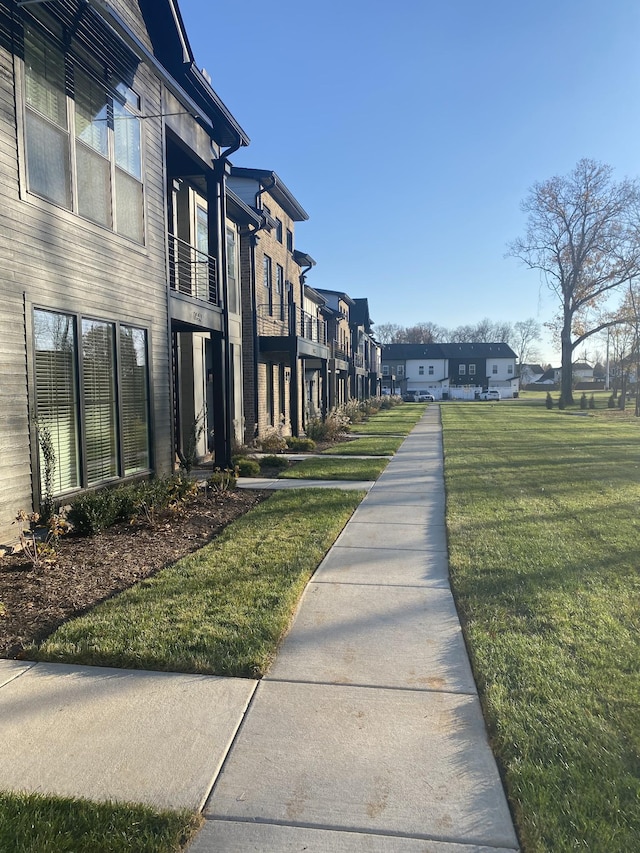 view of community featuring a residential view and a lawn