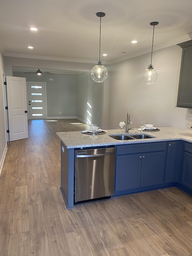 kitchen with stainless steel dishwasher, a sink, crown molding, wood finished floors, and hanging light fixtures