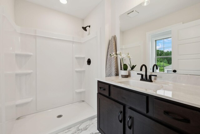1543 Fredrick Dr, Clarksville, TN 37042 - full bathroom featuring a shower, vanity, and marble look tile flooring