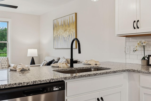 1543 Fredrick Dr, Clarksville, TN 37042 - kitchen featuring stainless steel dishwasher, decorative backsplash, white cabinetry, light stone countertops, and a ceiling fan