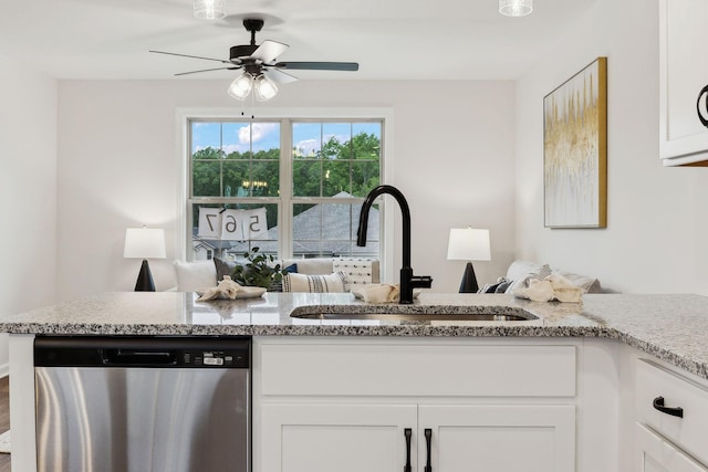 1543 Fredrick Dr, Clarksville, TN 37042 - kitchen with dishwasher, ceiling fan, light stone countertops, and white cabinetry