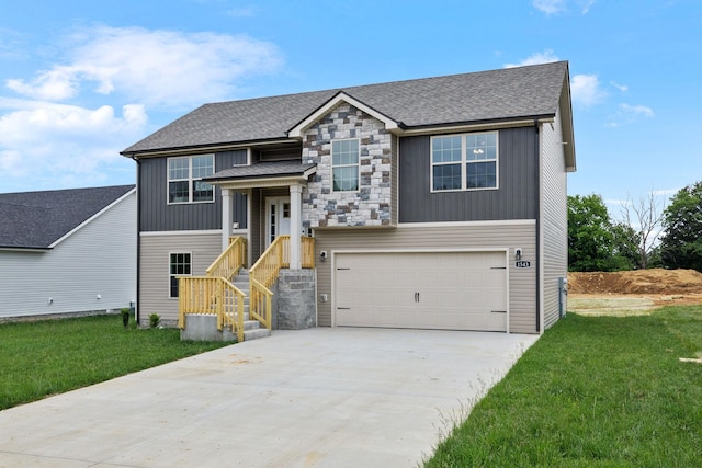 1543 Fredrick Dr, Clarksville, TN 37042 - view of front facade featuring an attached garage, concrete driveway, a front yard, and roof with shingles