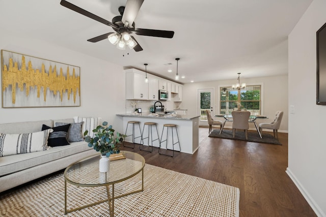 1543 Fredrick Dr, Clarksville, TN 37042 - living room with dark wood-type flooring, a chandelier, a ceiling fan, and recessed lighting