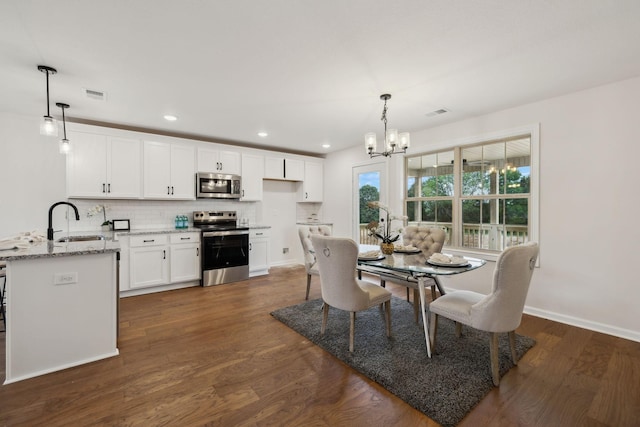 1543 Fredrick Dr, Clarksville, TN 37042 - dining area featuring a chandelier, dark wood-style floors, and recessed lighting