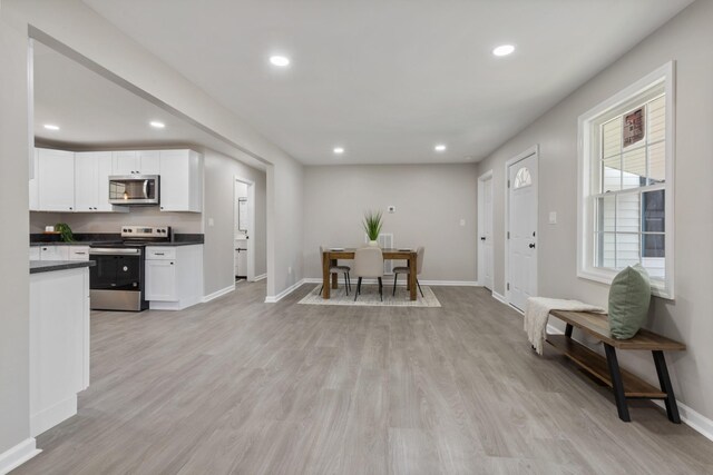400 Log Wall Rd, Dickson, TN 37055 - kitchen featuring appliances with stainless steel finishes, baseboards, dark countertops, white cabinetry, and recessed lighting