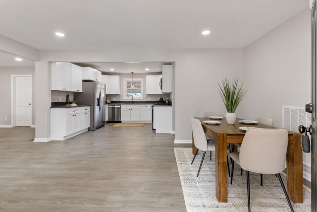 400 Log Wall Rd, Dickson, TN 37055 - dining space with baseboards, light wood-style floors, and recessed lighting