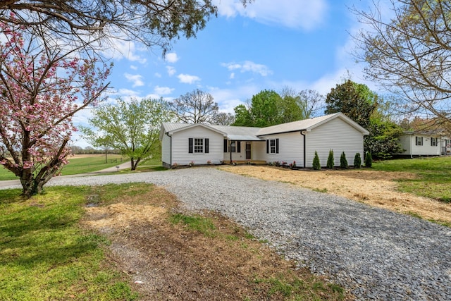 400 Log Wall Rd, Dickson, TN 37055 - ranch-style home with gravel driveway and a front lawn