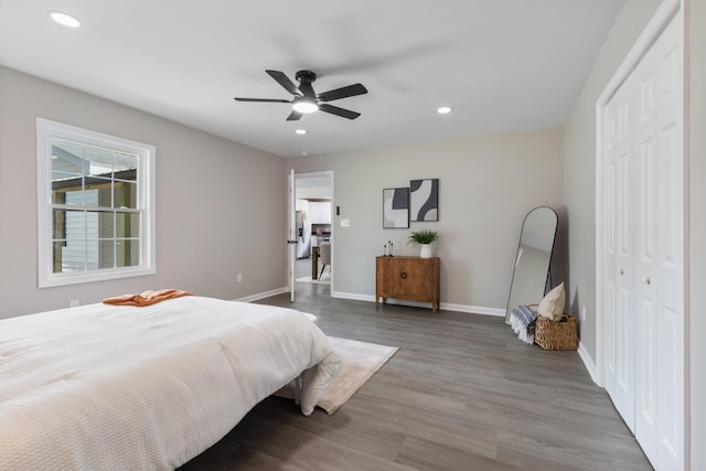 400 Log Wall Rd, Dickson, TN 37055 - bedroom featuring baseboards, recessed lighting, stainless steel fridge, wood finished floors, and a closet