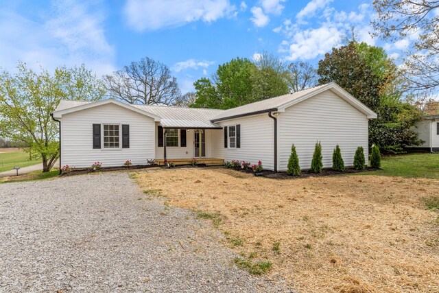400 Log Wall Rd, Dickson, TN 37055 - single story home featuring metal roof, gravel driveway, and a porch