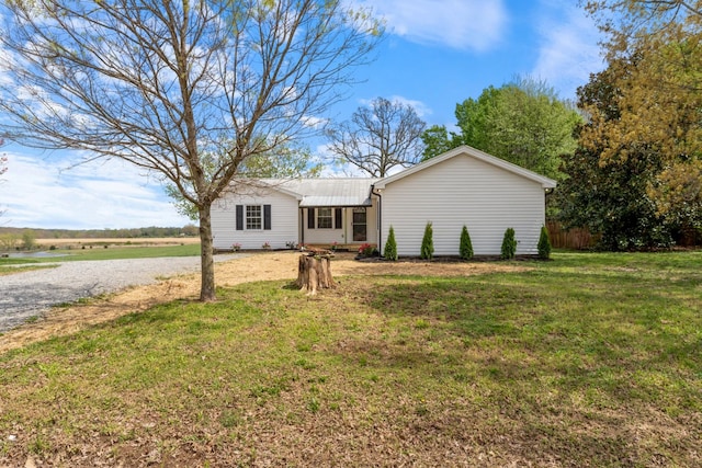 400 Log Wall Rd, Dickson, TN 37055 - single story home with a front yard, driveway, and metal roof