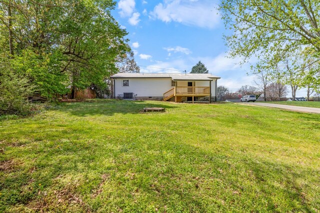 400 Log Wall Rd, Dickson, TN 37055 - view of grassy yard with stairway, central AC unit, and a deck