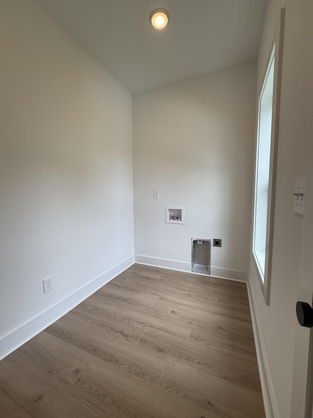 laundry room featuring hookup for an electric dryer, washer hookup, wood finished floors, baseboards, and recessed lighting