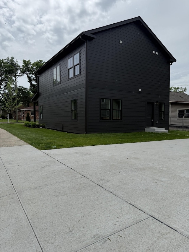 view of home's exterior with a yard