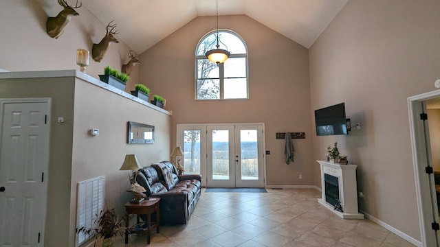 460 Mate Allen Rd, Gainesboro, TN 38562 - living area with high vaulted ceiling, french doors, light tile patterned flooring, baseboards, and a fireplace